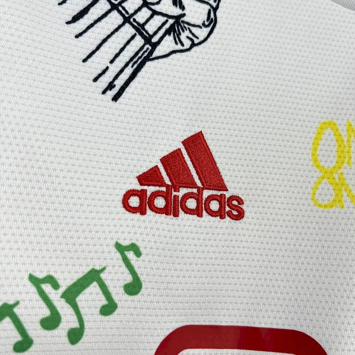 Maillot Ajax Bob Marley Concept 25/26 - détail logo et tissu